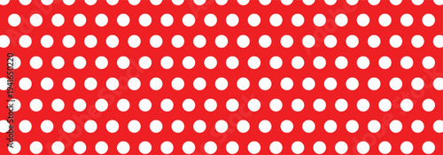 White polka dot seamless pattern on red color background.  Polka dot background used in branding for children items, toys, packaging, feminine dresses and textile design. EPS 10.
