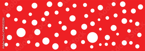 Different size white polka dots seamless pattern isolated on a red background.  Polka dot vector background used in branding for children items, toys, packaging, feminine dresses and textile design. 