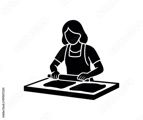 Solid icon of a person wearing an apron using a rolling pin across two flattened pieces on a workboard for baking or clay work.