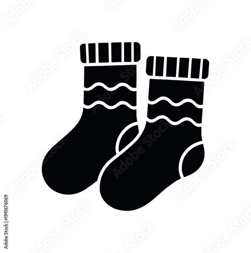 Black silhouette of a pair of warm socks with ribbed cuffs and wavy pattern across the ankles, shown as a clean flat icon suitable for wardrobe or holiday designs.