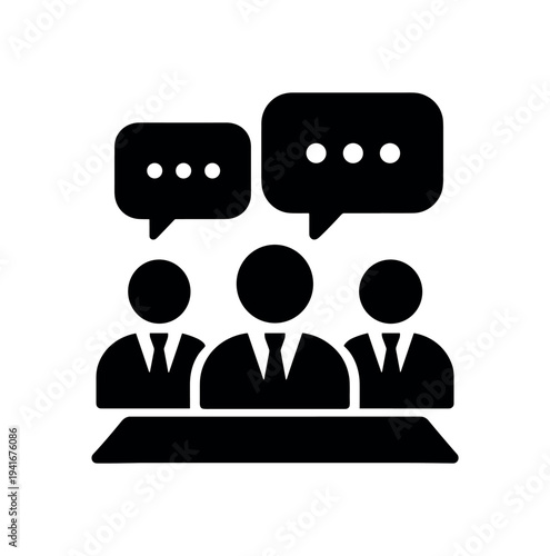 Solid black icon of three suited figures behind a table with speech bubbles above, representing a meeting, panel, or group discussion.