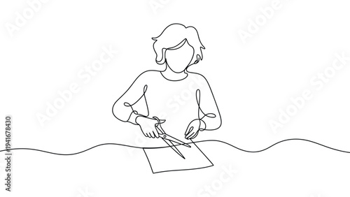 continuous line drawing of person cutting paper with scissors representing creativity, craft activity, handmade work and artistic process concept