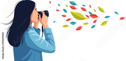 Photographer capturing the motion of colorful falling leaves in autumn