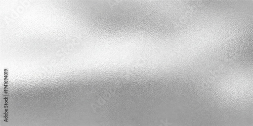 A shiny brushed metal texture with a light gray stainless steel pattern provides a blank metallic surface backdrop for a dark silver aluminum wallpaper design