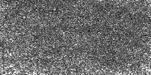 A dark and rough black and white metal texture background featuring a textured gray stone surface with a gritty pattern of concrete and weathered asphalt material for a modern wall backdrop