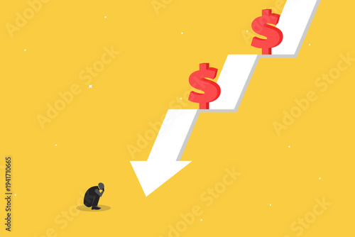 Businessman crouching in despair at a falling downward arrow with dollar symbols, representing financial loss, economic crisis, and bankruptcy