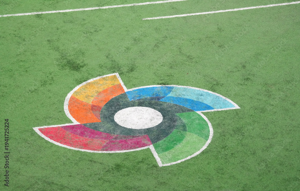 Fototapeta premium WBC logo painted on the green grass of a professional baseball stadium