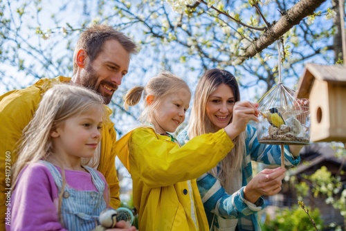 Family Kids Making Bird Feeders Attract Spring Birds Together