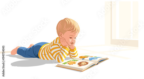 A young child with blond hair, wearing a striped shirt and blue pants, lies on his stomach on a light-colored floor, propped on his elbows, engrossed in an open picture book.