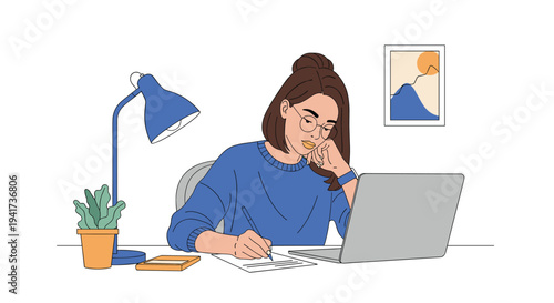 Focused young woman with glasses studying or working from home at her desk with a laptop, lamp, and writing in a notebook.