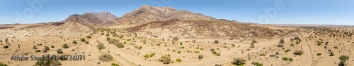 Aerial view, dry riverbed and desert landscape on the Ugab River, behind Brandberg, Erongo, Damaraland, Namibia