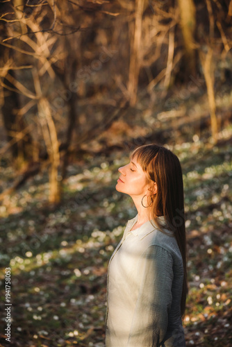 Woman in Early Spring Forest Taking Deep Breath