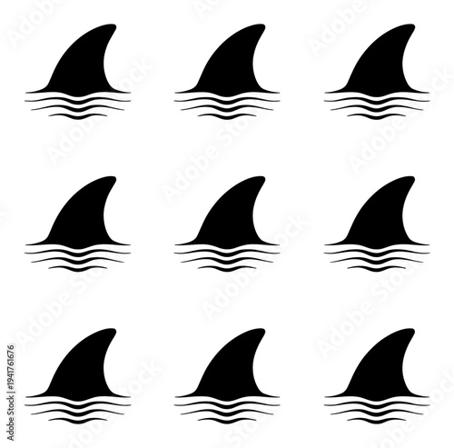 Nine Black Shark Fins Emerging from Wavy Water