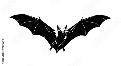 Black silhouette of a bat with outstretched wings flying.