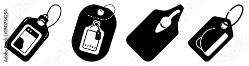 Set of four blank black plastic luggage tags with silver metal loops isolated on white background for travel identification