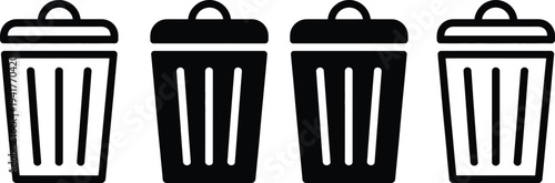 Four black trash bins lined up side by side with lids closed