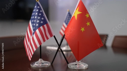 United States and China Crossed Table Flags on Wooden Surface