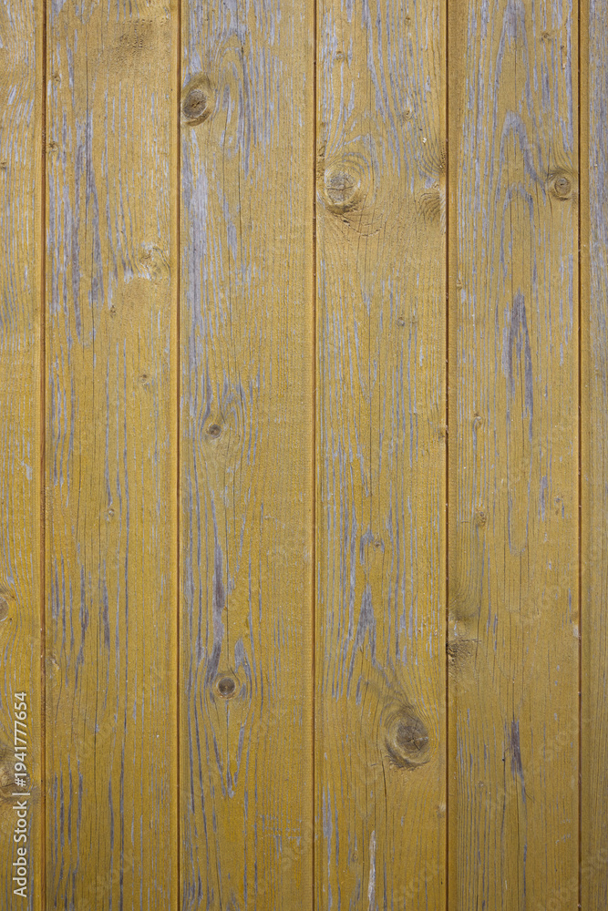 Fototapeta premium Weathered yellow wooden boards texture background with natural wood grain