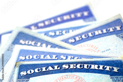 Fotografie Social Security Cards Piled in a Row Pile for Retirement Representing Stability