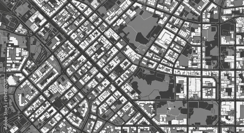 Aerial View of Urban Grid with Buildings and Green Spaces.
