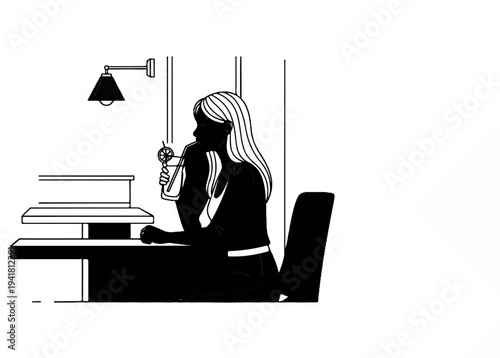 Silhouette of a woman at a desk with a drink and lamp