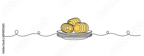 Butter curls stacked on ceramic plate in minimalist setting