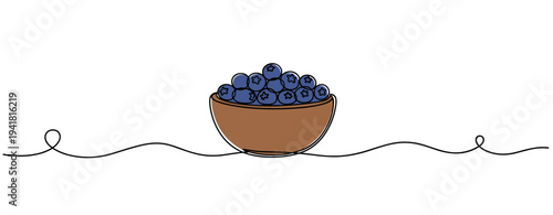 Bowl filled with blueberries resting on linear surface