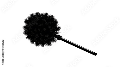 A fluffy black duster on a neutral background. The duster is made of soft, feathery material and has a long, slender handle