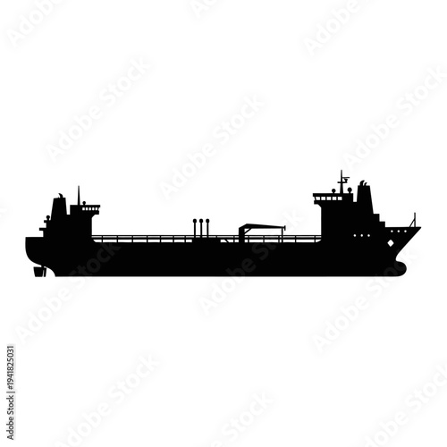 Silhouette of a large cargo ship at sea.