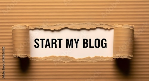 Digital Content Creation: Start my blog text inside torn corrugated cardboard, online publishing, creative writing and social media marketing concept