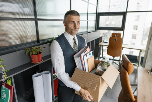 Business man packing stuff empty office. Last day at work. Upset office worker fired. Fired and unemployment with business man. Job loss. Fired jobless employee. Unemployment crisis of man dismissed