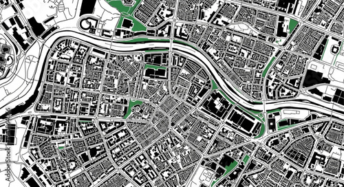 Aerial View of a City with River and Green Spaces.