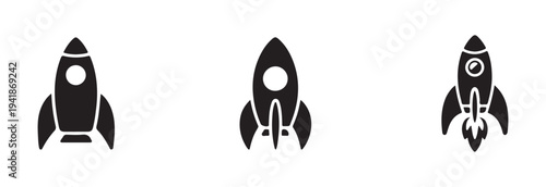 Simple black silhouette icons set of three retro style spaceships ready for launch in different poses