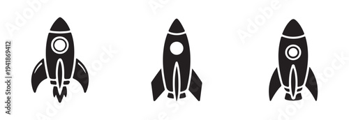 Three distinct black silhouette icons showing cartoon rocket ships in various stages of space flight or ready for take off