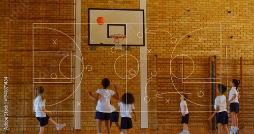 Playing kids in white Ts navy shorts reaching for basketball above hoop in school-gym, X or O overla