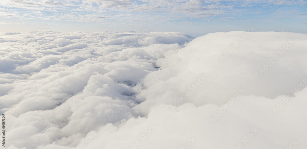 Obraz premium Aerial View of Soft White Clouds Under Pale Blue Sky, Serene Cloudscape 3D Rendering