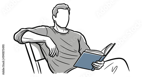 A man sitting comfortably reading a book in a chair