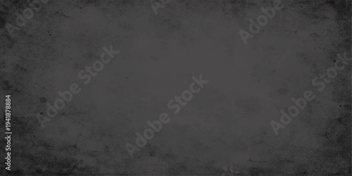 A dark vintage grunge wall texture features a rough gray concrete surface with a dirty stone pattern and old paper effects for a weathered cement backdrop