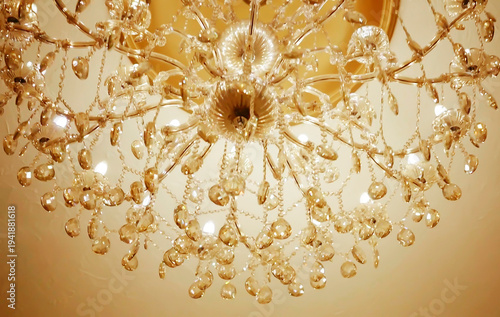 Luxury chandelier lamp with crystal sparkle golden light furniture decorated in modern condominium or elegant hotel for gala dinner isolated on black background with copy space.