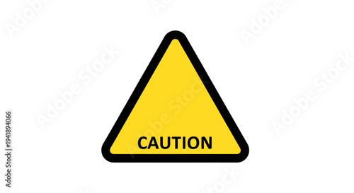 A yellow caution sign with black border and text on a neutral background viewed from directly above