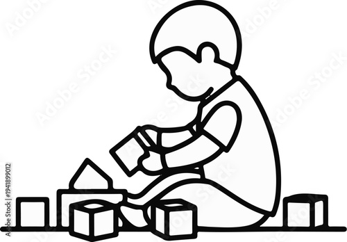 A child sits on the floor, engaged in building with toy blocks