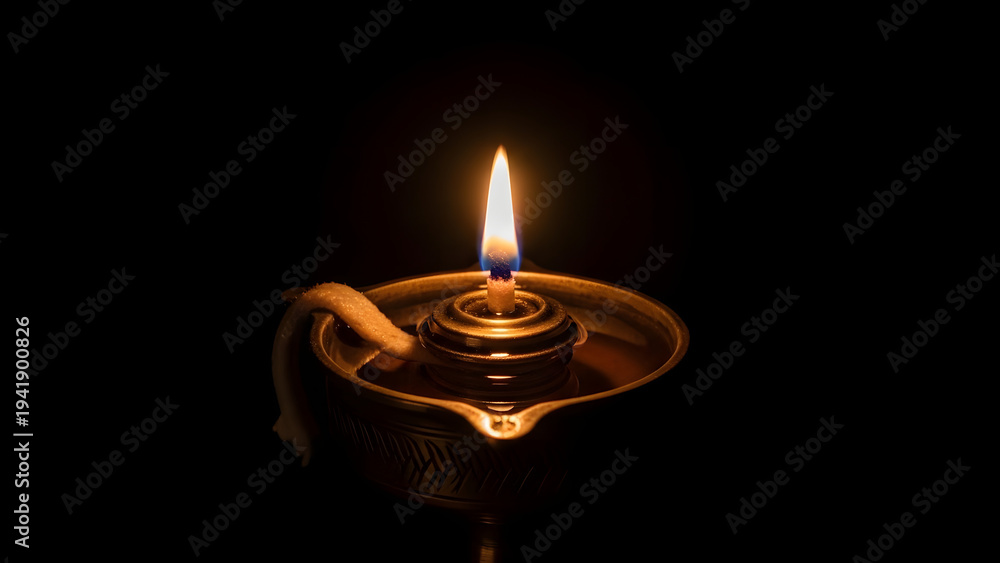 Fototapeta premium Serene Traditional Oil Lamp with Flickering Flame Soft Warm Golden Lighting Peaceful Ambiance Cinematic Photography