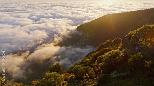 Aerial view of sunrise above clouds on Madeira island, Portugal