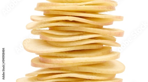 Stack of thinly sliced apples on white background