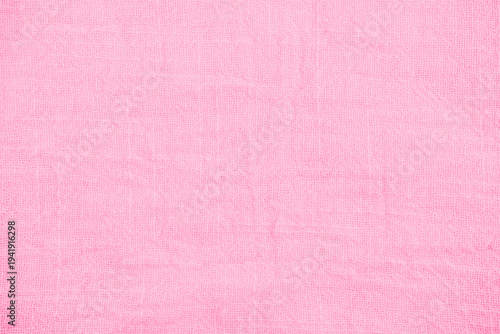 Delicate soft pastel pink terrycloth fabric texture background featuring fluffy cotton material surface