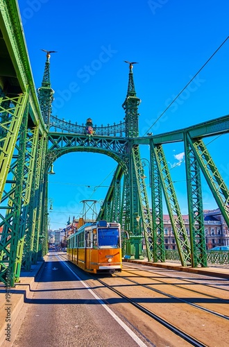 The retro tram on historic Liberty Bridge, Budapest, Hungary