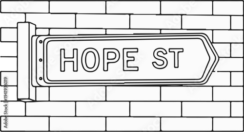 A sign pointing the way on a brick wall