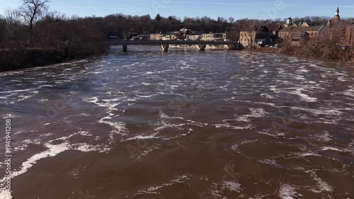 Aerial Drone View of Spring Waterfall and Rapid River Flow During Snowmelt in Paris Ontario Canada