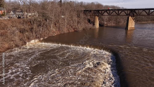 Aerial Drone View of Spring Waterfall and Rapid River Flow During Snowmelt in Paris Ontario Canada