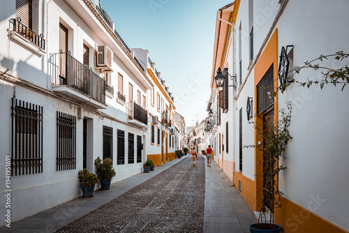 narrow, historic street in the old town (La Juderia) of Cordoba, Spain.